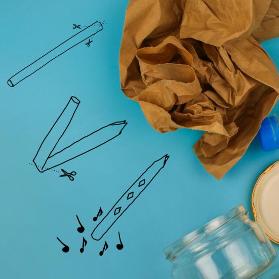 Billedet viser nogle tegnede instrumenter på et stykke papir med flasker, dåser og lignende ovenpå